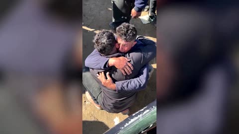 Palestinian twins share emotional embrace after a year apart