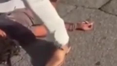 Woman points gun at a Father & son during road rage argument. She is disarmed and KTFO