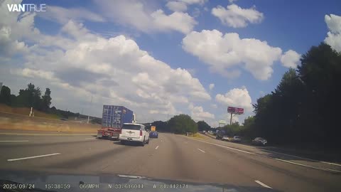 Truck driver doesn't see car during afternoon commute.