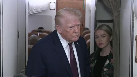 Trump speaks to reporters on Air Force One