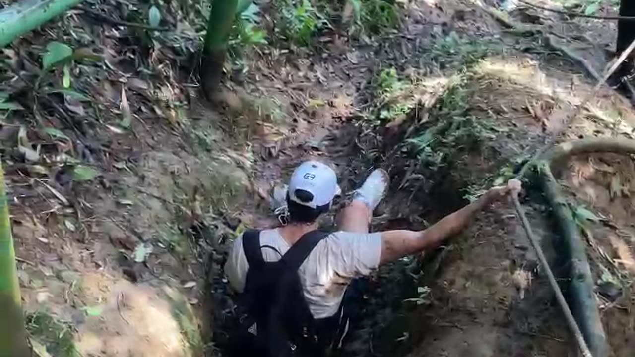 Man Feeling Goofy Jumps Into Muddy Hole