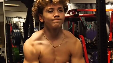 Teen boy flexing muscles