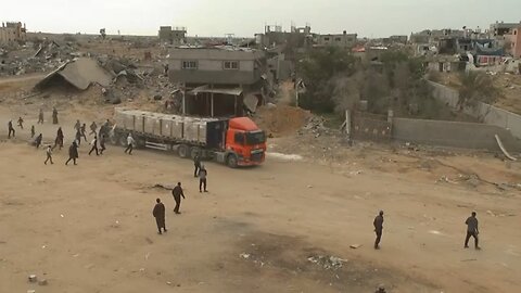 Palestinians in Gaza scramble for aid as trucks drive through Rafah