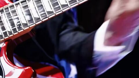 Donald Trump plays money for nothing on the guitar.