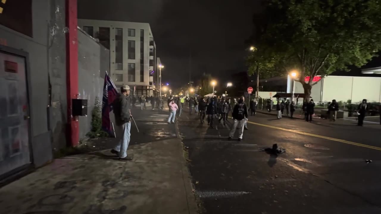 Massive fight outside ICE in Portland, pepper balls fired.