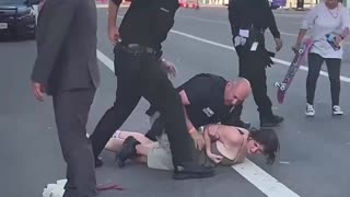 Cop Drags & Punches Woman Blocking the Road – Justified or Excessive Force?