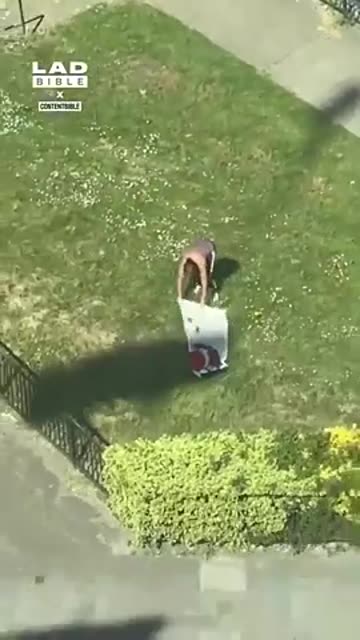 CRANE DRIVER KEEPS MOVING THE CRANE AND BLOCKING THE SUN FROM TANNING WOMAN