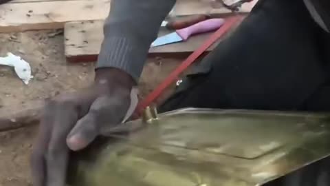 A displaced Palestinian man built a water heater and shower from scratch