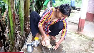 village_girl_cooks_chicken_gravy_with_traditional_spices_on_firewood_stove(720p)