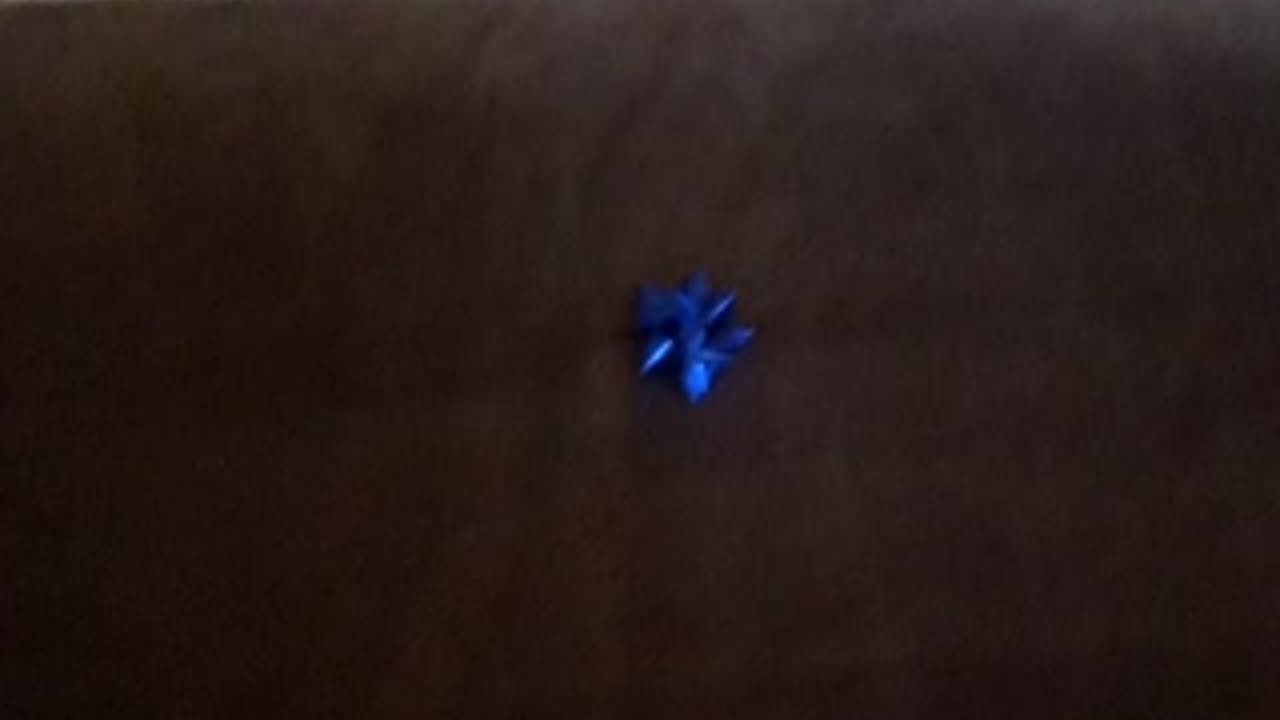 The couch sofa is a present! A bluw, uh, blue bow is on top of it!