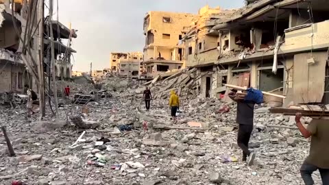 Palestinians inspect damage in ruined Gaza neighborhoods