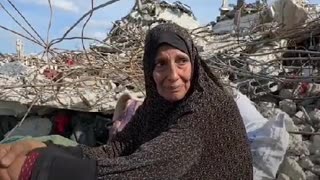 Mother sits on the ruins of her house - Asks for a pillow or a matteress