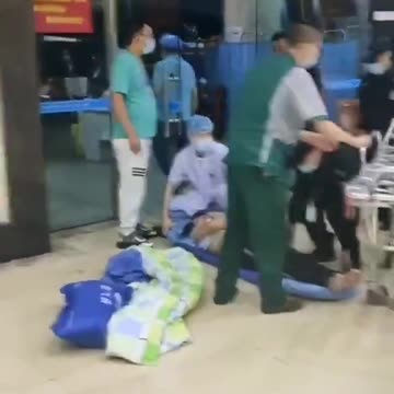 A man is crying, because the hospital refuses to treat his family member, who doesn't have a val..