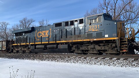 Long Train led by 7214 heading West with a DPU