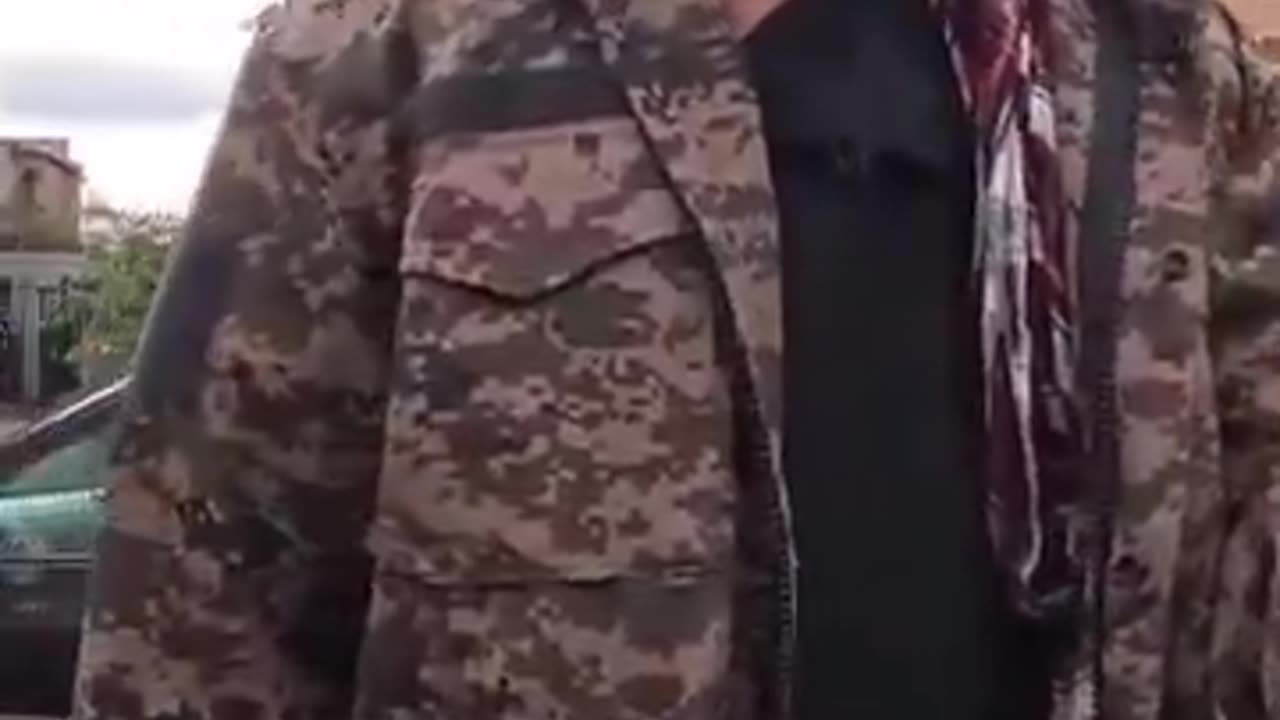 In Luton an Afghan asylum seeker comes out of his accommodation. Wearing what