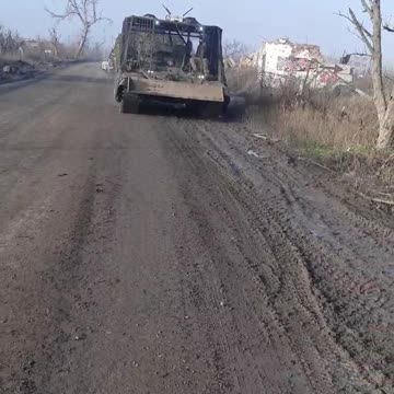 The M2 Bradley is being recovered by 2 BREMs.
