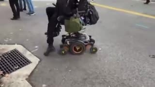 Wheelchair bound ICE rioter instantly healed. Caught on Camera. Minneapolis, Minnesota