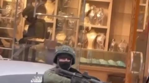 Israeli terrorists rob jewellery store in Hebron, Palestine.