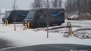 Man films a fleet of "green" Amazon electric vehicles charging in the snow 🤡