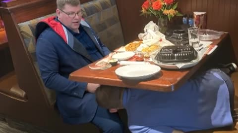 Mickey loving Kevin underneath the table