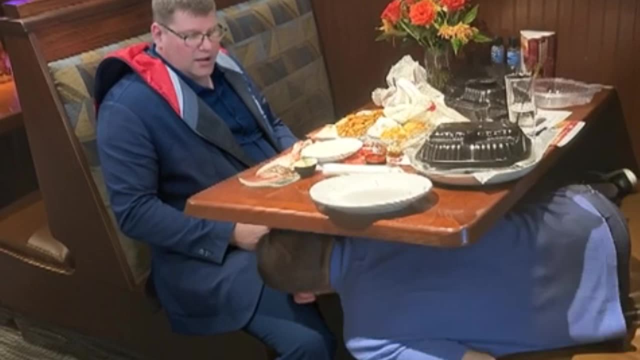 Mickey loving Kevin underneath the table