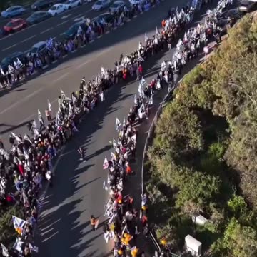 ADMIN POST. Israelis line the route of the funeral of leader