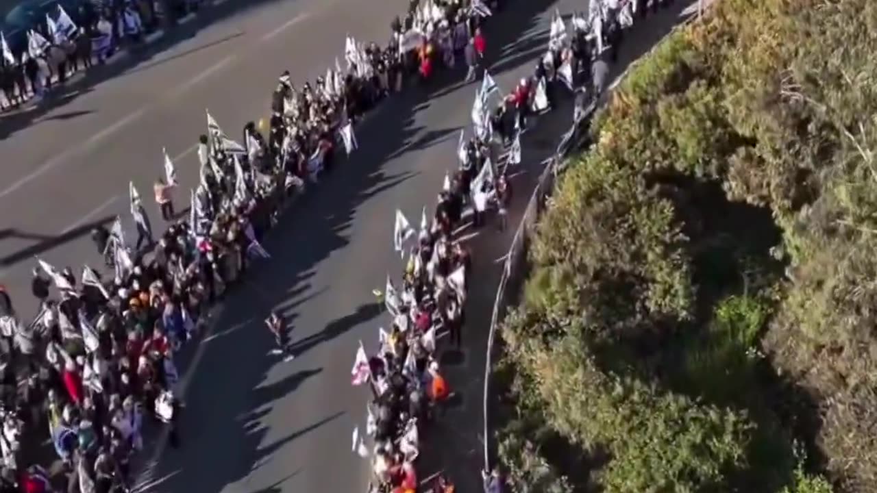 ADMIN POST. Israelis line the route of the funeral of leader