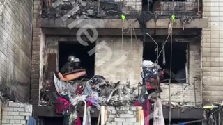 The damaged house in Vyshhorod now. Volunteers, despite air raid sirens, are shoveling