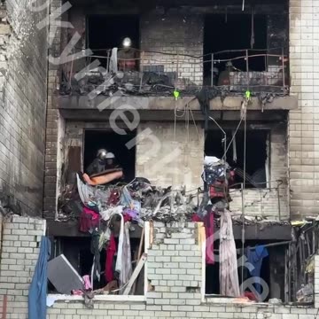 The damaged house in Vyshhorod now. Volunteers, despite air raid sirens, are shoveling