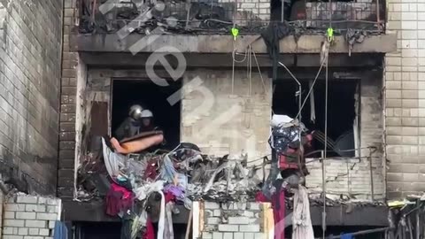 The damaged house in Vyshhorod now. Volunteers, despite air raid sirens, are shoveling