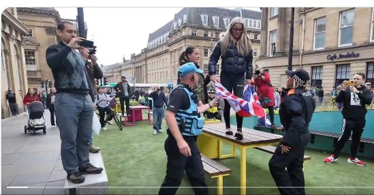 British Police now confiscate English Flags from young women