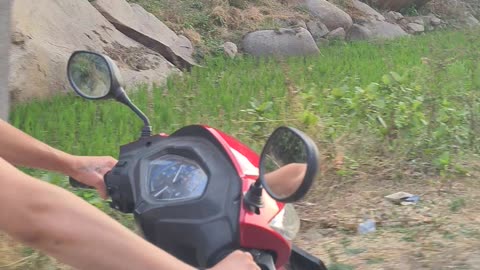 Barefoot riding a scooter!!🛵#hampi #india