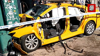 NYC cab left in pieces after crashing into a pole outside the Chinese consulate