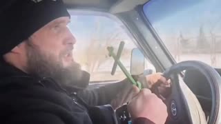 Russian Priest Doing Drive-By Blessings of Russian Troops and Equipment