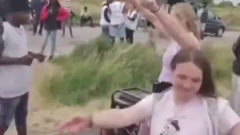 French girls dance for fake asylum seekers.