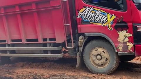 on a truck loaded with palm oil going up an extreme incline