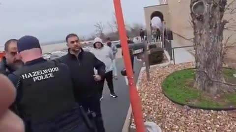 A group of Muslims attempt to force a Christian preaching on a public sidewalk