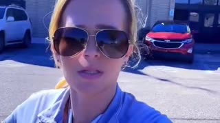 Woman records the Muslim call to prayer being broadcast over loudspeakers in Dearborn, Michigan.