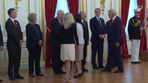 Trump introduces Japan's newly elected PM to his delegation in Tokyo, Japan.