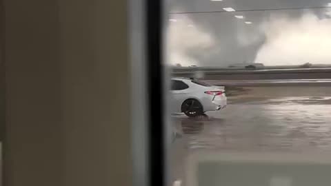 Moment of a large tornado over southwest of Houston, near El Campo, Texas