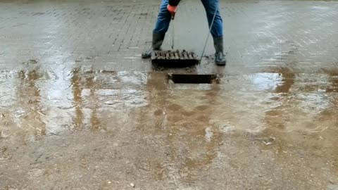 Unclogging a Storm drain after raining