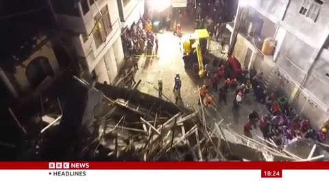 At least three dead and dozens trapped after Indonesia school collapses
