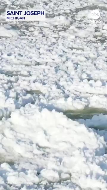 Aerial footage shows pancake ice rolling over waves on Lake Michigan, as cold
