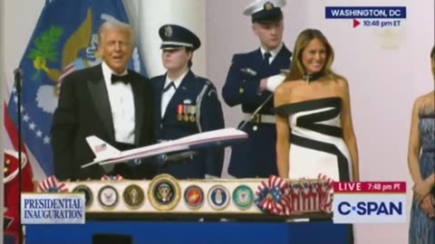 President dancing while waving a sword in the air