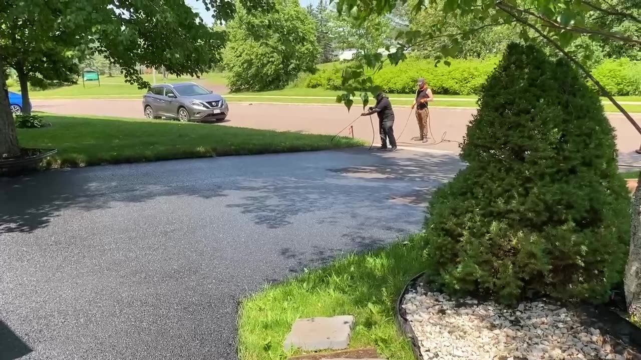 Me Spray Sealing A Driveway With A Great Song "Bad by U2" Dubbed In - Top Coats Pavement Maintenance