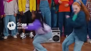 Two girls having a dance battle