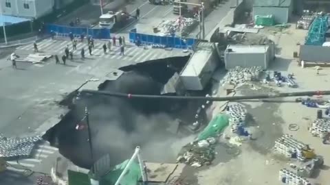 NEW - Huge sinkhole swallows major stretch of roadway in Shanghai, China.