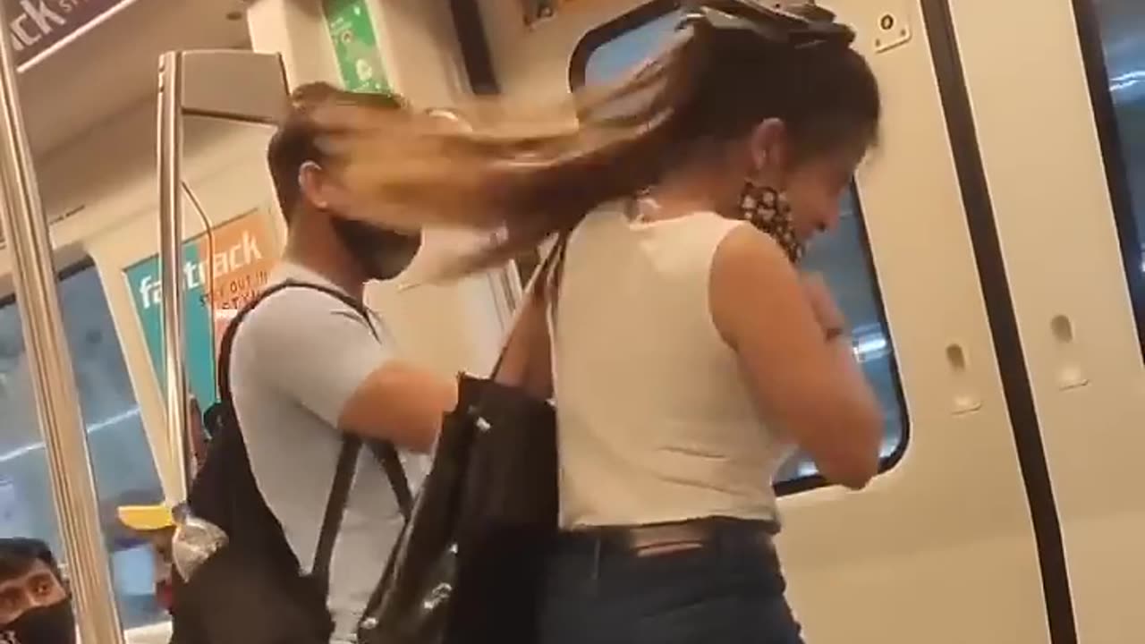 Girl fighting with boy in metro