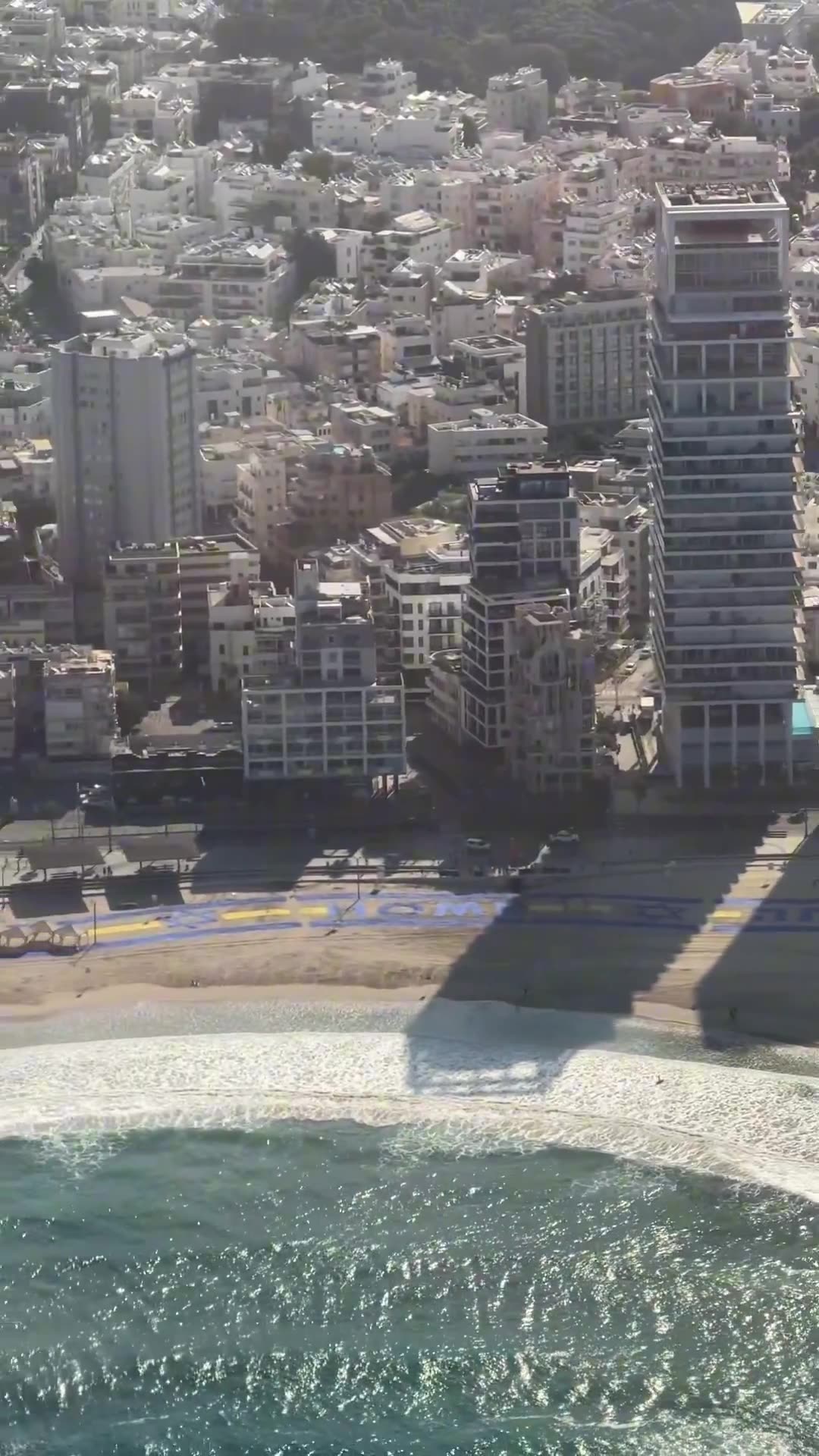 Air Force One flies over sign thanking President Trump on the beach of Tel Aviv!
