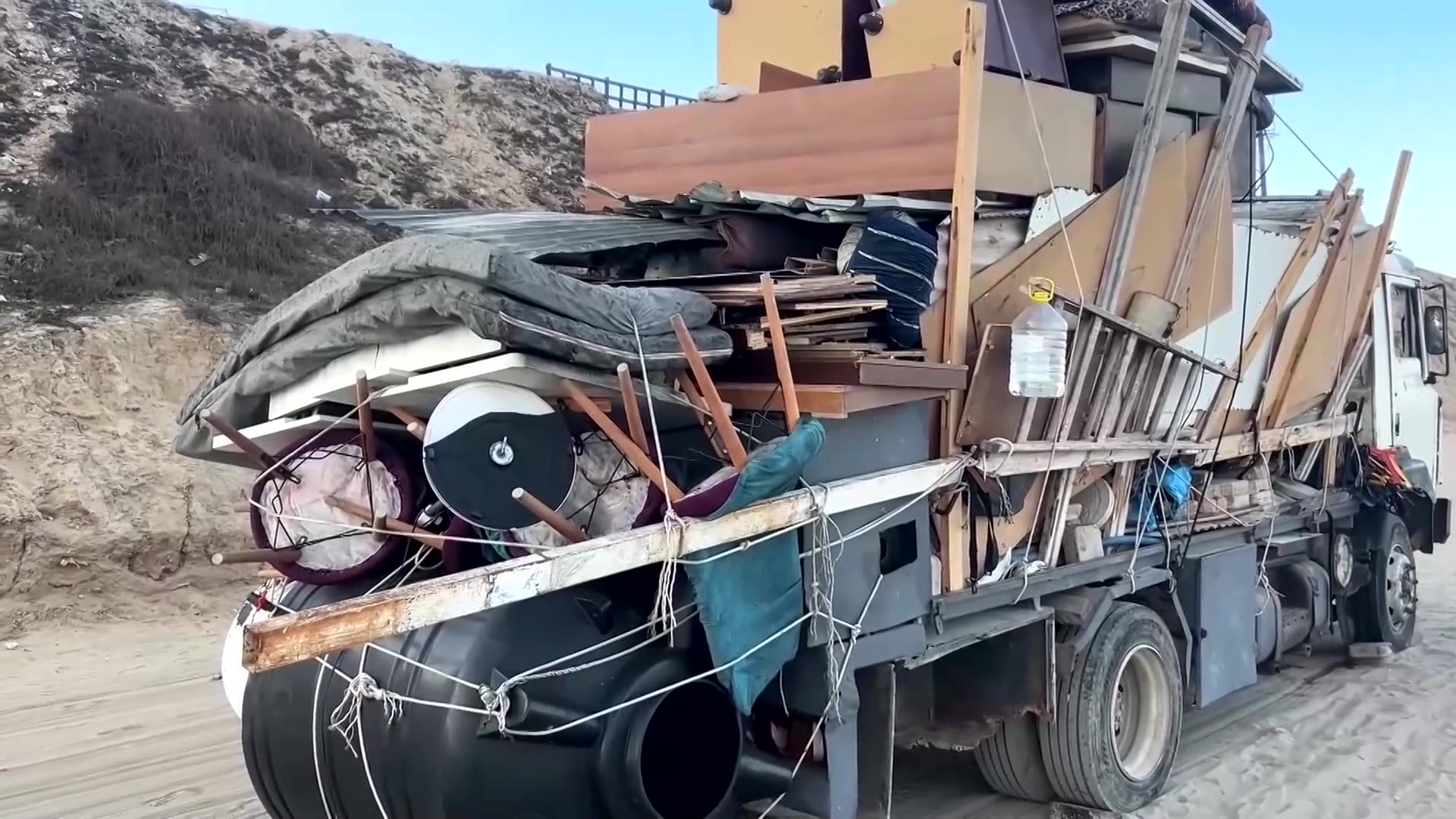 Palestinians shelter in makeshift roadside tents in central Gaza